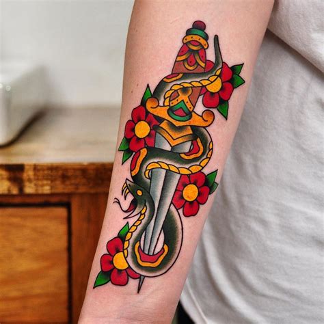 traditional snake and dagger tattoo.